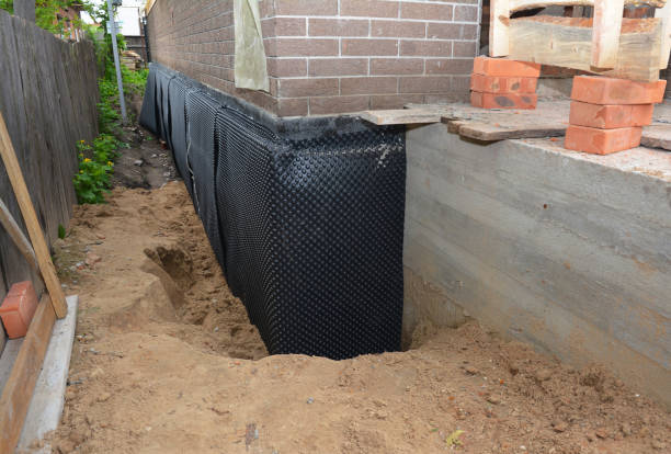 Happy homeowners after waterproofing job in Moonachie